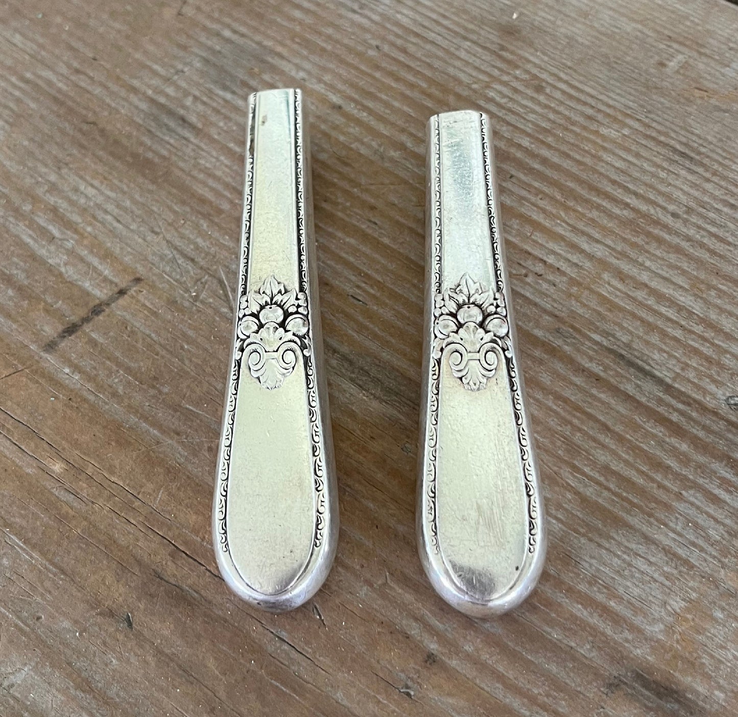 Close-up of handcrafted 1847 Rogers Adoration knife vase showing polished hollow handle and decorative pattern