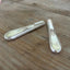 Magnet close-up of handmade vase from 1847 Rogers Adoration knife  vintage silverplate 