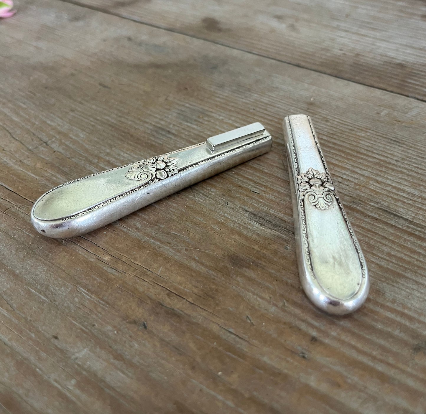 Magnet close-up of handmade vase from 1847 Rogers Adoration knife  vintage silverplate 