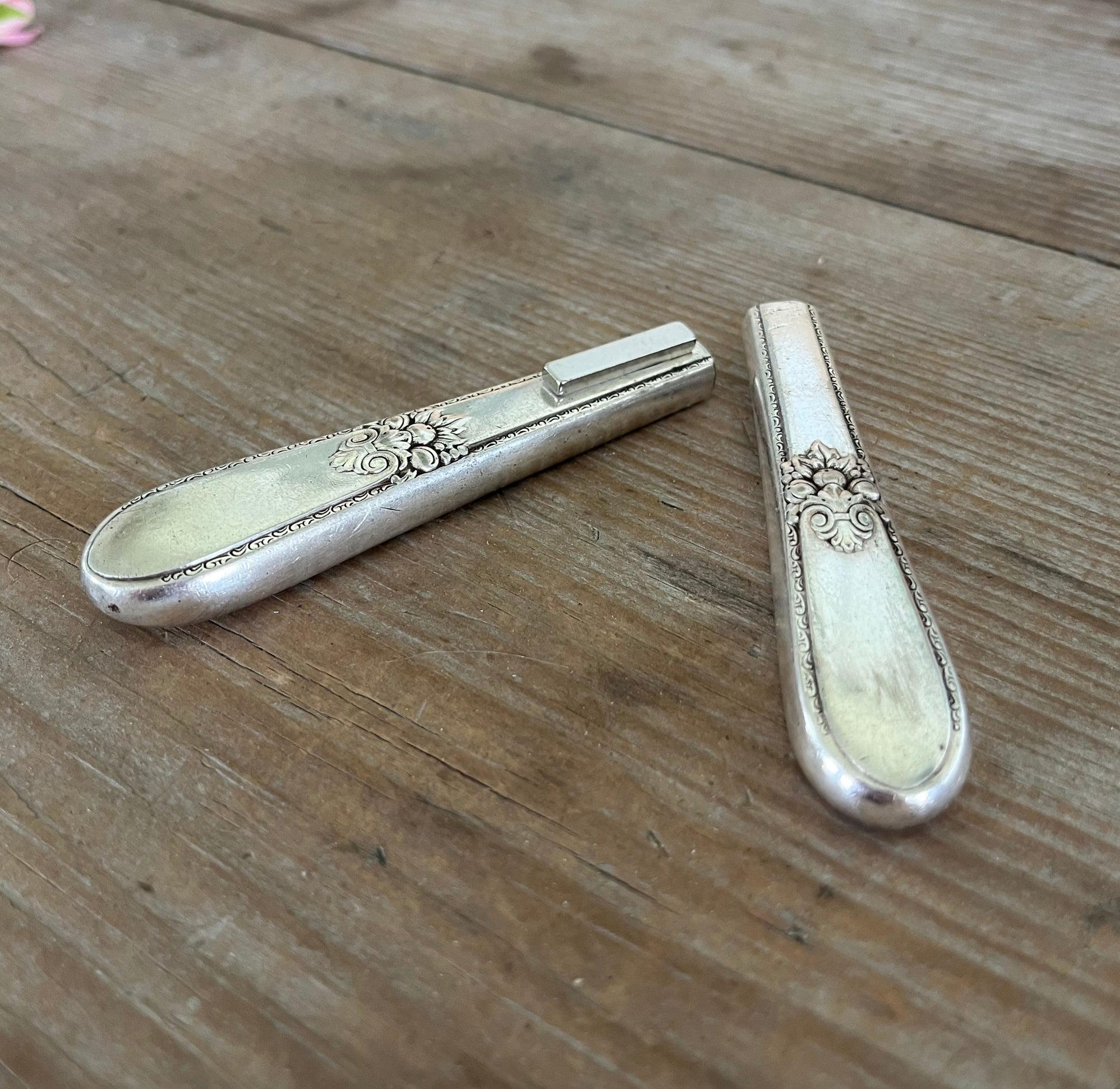 Magnet close-up of handmade vase from 1847 Rogers Adoration knife  vintage silverplate 