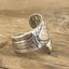Close up of Andrew Jackson presidential spoon ring made from upcycled vintage silverware - handmade artisan jewelry