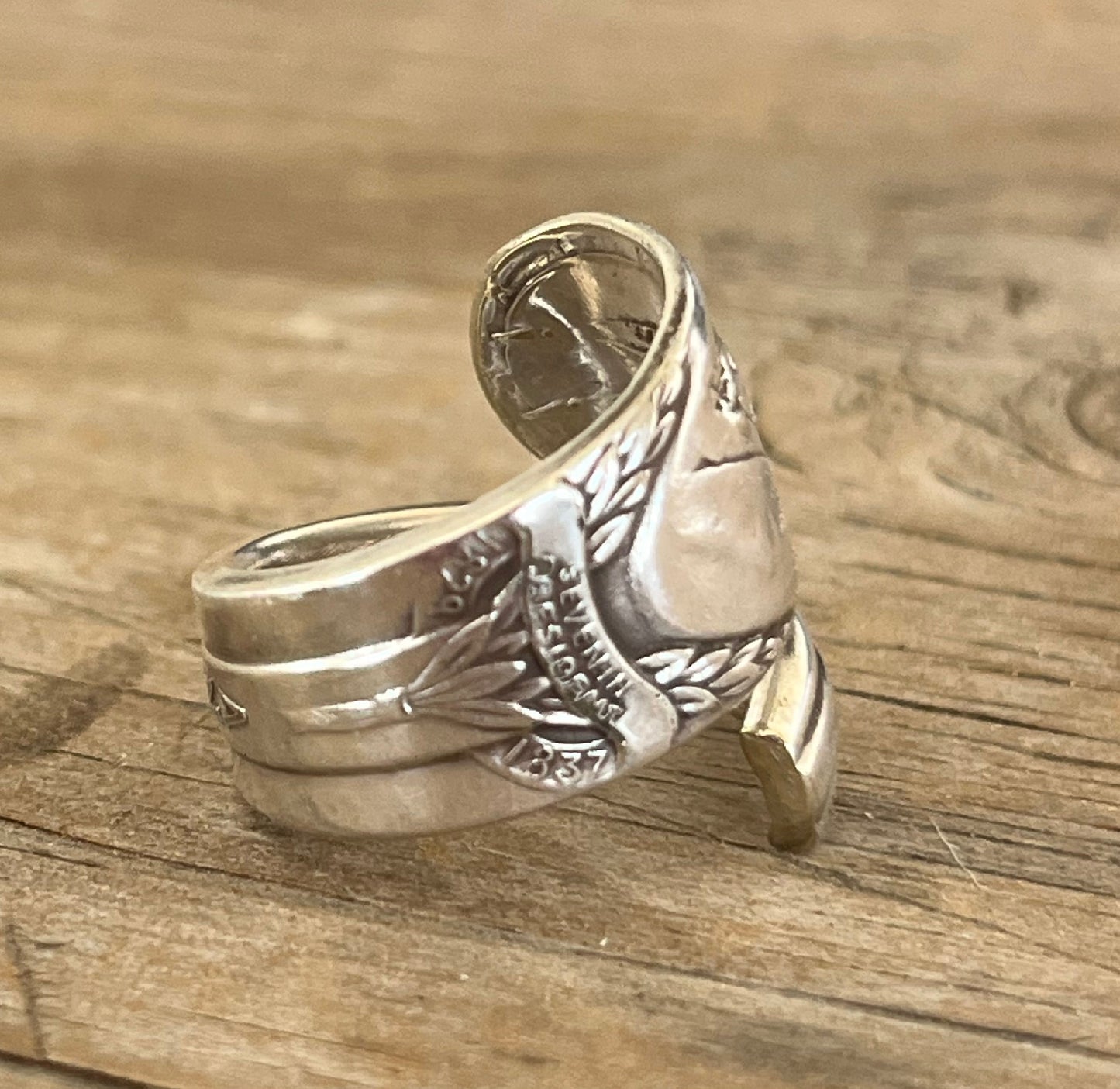Close up of Andrew Jackson presidential spoon ring made from upcycled vintage silverware - handmade artisan jewelry