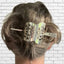 Cake server hair barrette worn in hair showing functional use and size