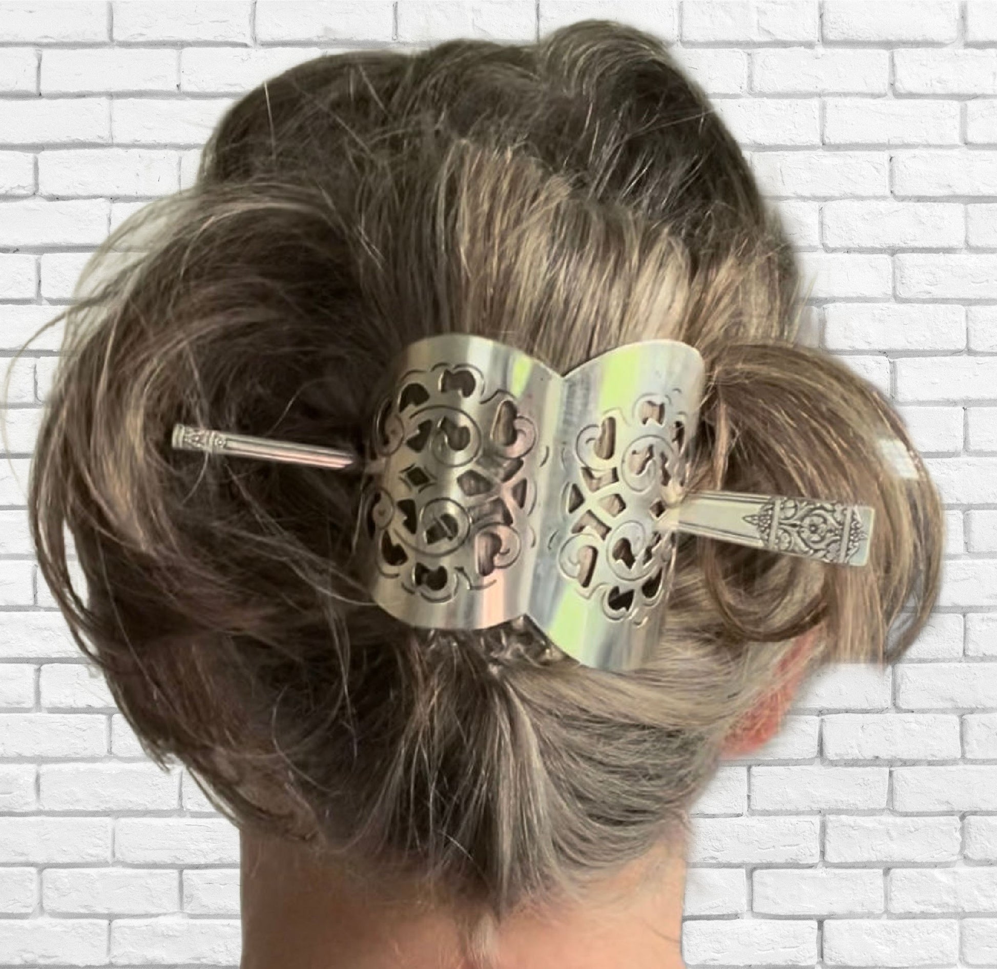 Cake server hair barrette worn in hair showing functional use and size
