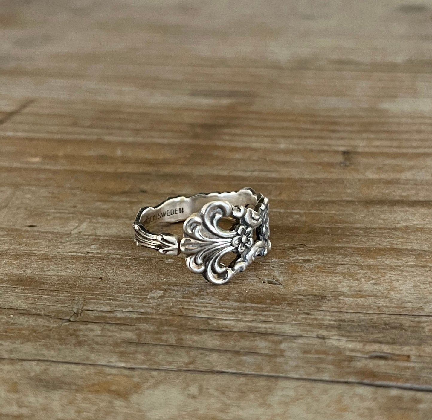 Detail of SWEDEN pattern spoon ring highlighting delicate openwork on this upcycled silverware design
