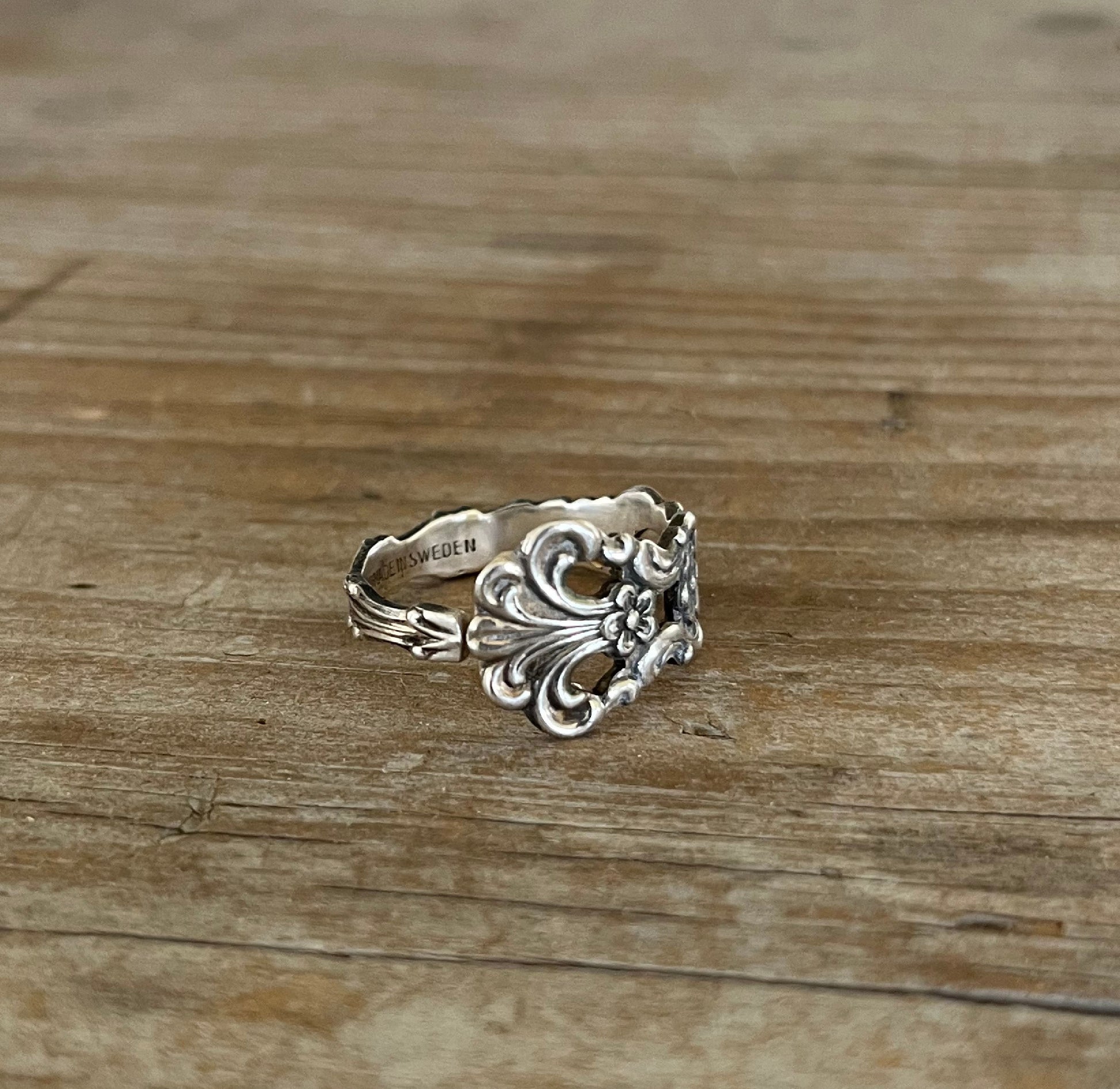Detail of SWEDEN pattern spoon ring highlighting delicate openwork on this upcycled silverware design