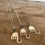 Trio of handcrafted fork elephant pendants showing variety of bead colors and shapes