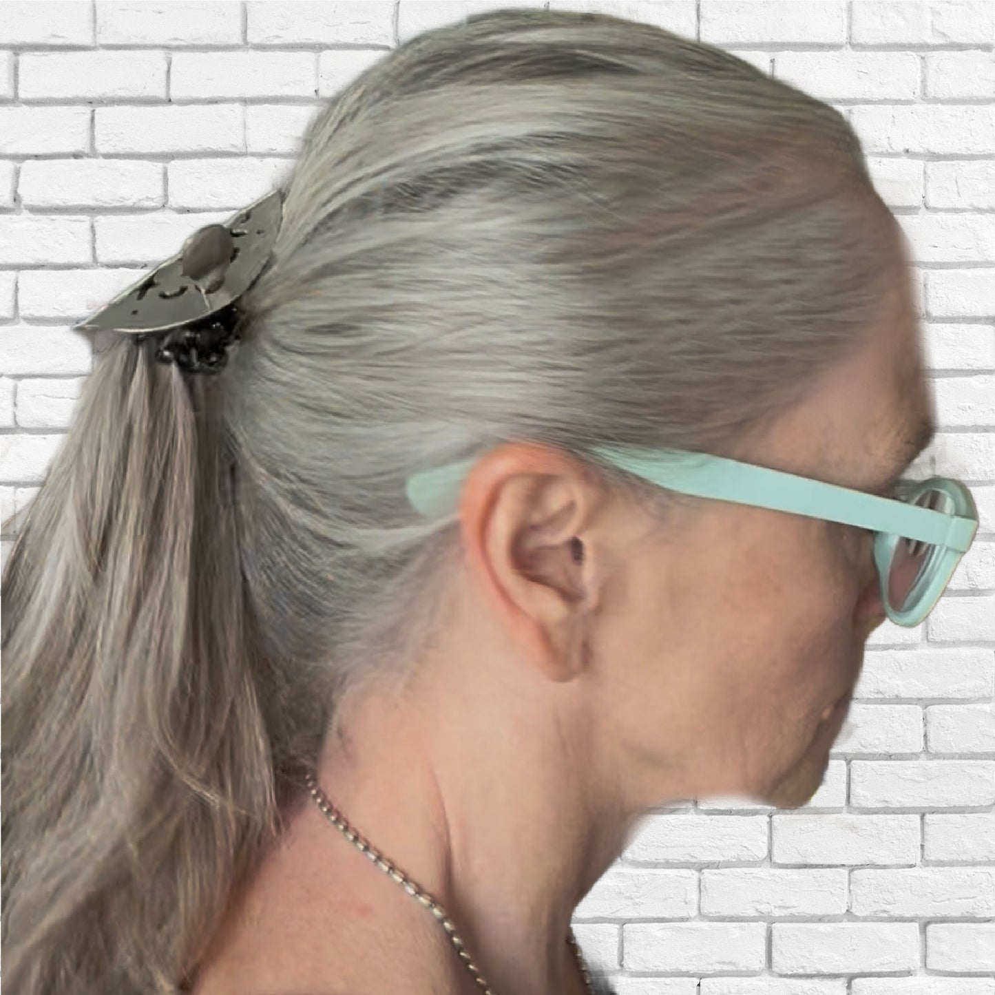 Side view of vintage cake server ponytail barrette securing a ponytail - upcycled silverware hair accessory - Laughing Frog Studio
