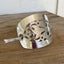 Handcrafted Art Deco barrette close-up showing upcycled vintage cake server ornate floral design