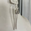 Fork tine earrings with playful owl charm beads showing one-of-a-kind upcycled silverware design