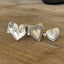 Collection of handmade heart spoon rings crafted from vintage silverplate silverware by Laughing Frog Studio