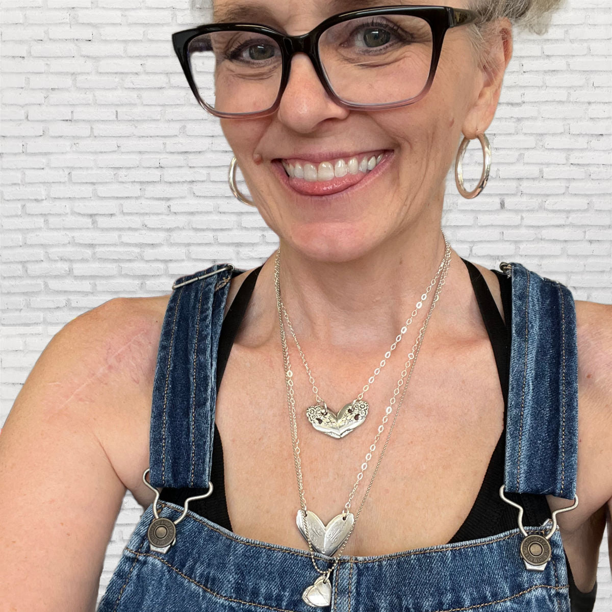 Heart necklace on model showing pendant size and 17-inch chain length, upcycled vintage silverware jewelry