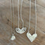 Collection of three fork heart necklaces displaying variety of vintage silverware patterns