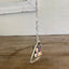 Side angle of fork tine heart necklace with customizable photo frame, romantic upcycled silverplate keepsake pendant