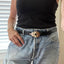 Guitar spoon belt buckle handcrafted from upcycled vintage silverplate - worn on model with vintage Levi's jeans - Laughing Frog Studio