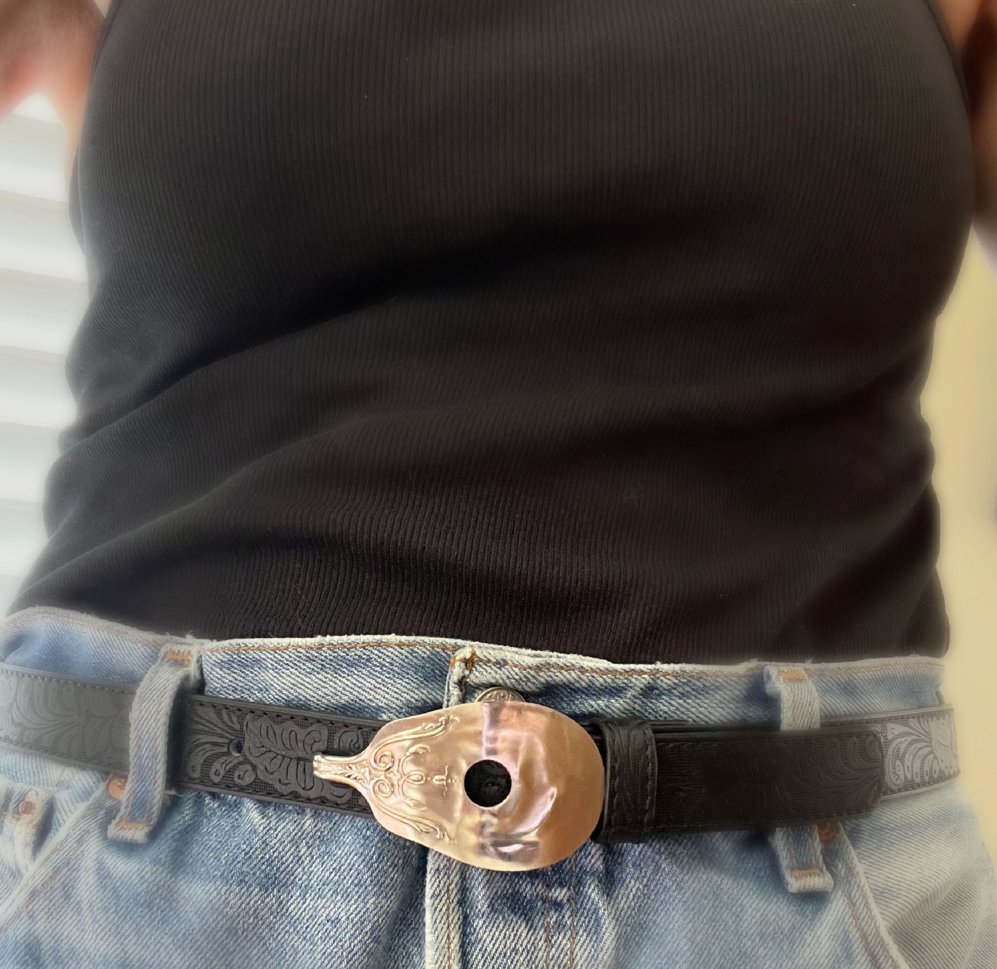 Close-up of guitar spoon belt buckle on leather snap belt with vintage Levi's - upcycled silverware accessory - Laughing Frog Studio