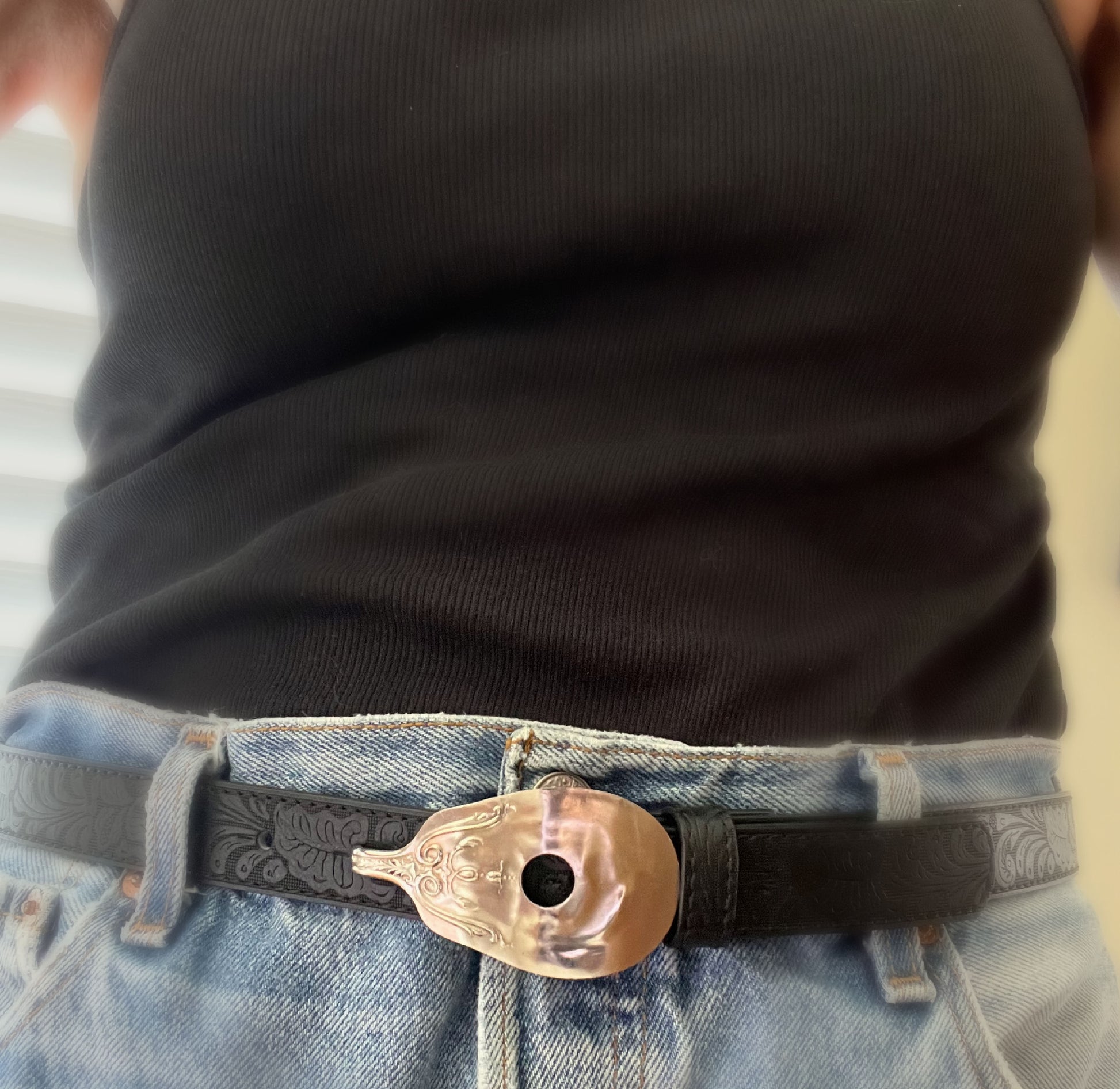 Close-up of guitar spoon belt buckle on leather snap belt with vintage Levi's - upcycled silverware accessory - Laughing Frog Studio