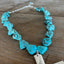 Chunky turquoise howlite beads with silverplate accents on adjustable choker necklace with spoon cross