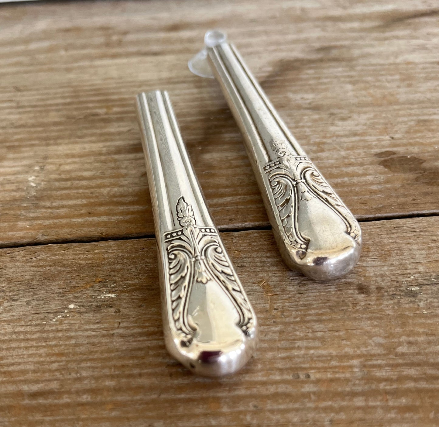 Close-up of handcrafted R.C. Co. Avalon knife vase showing Art Deco curves and polished hollow handle detail