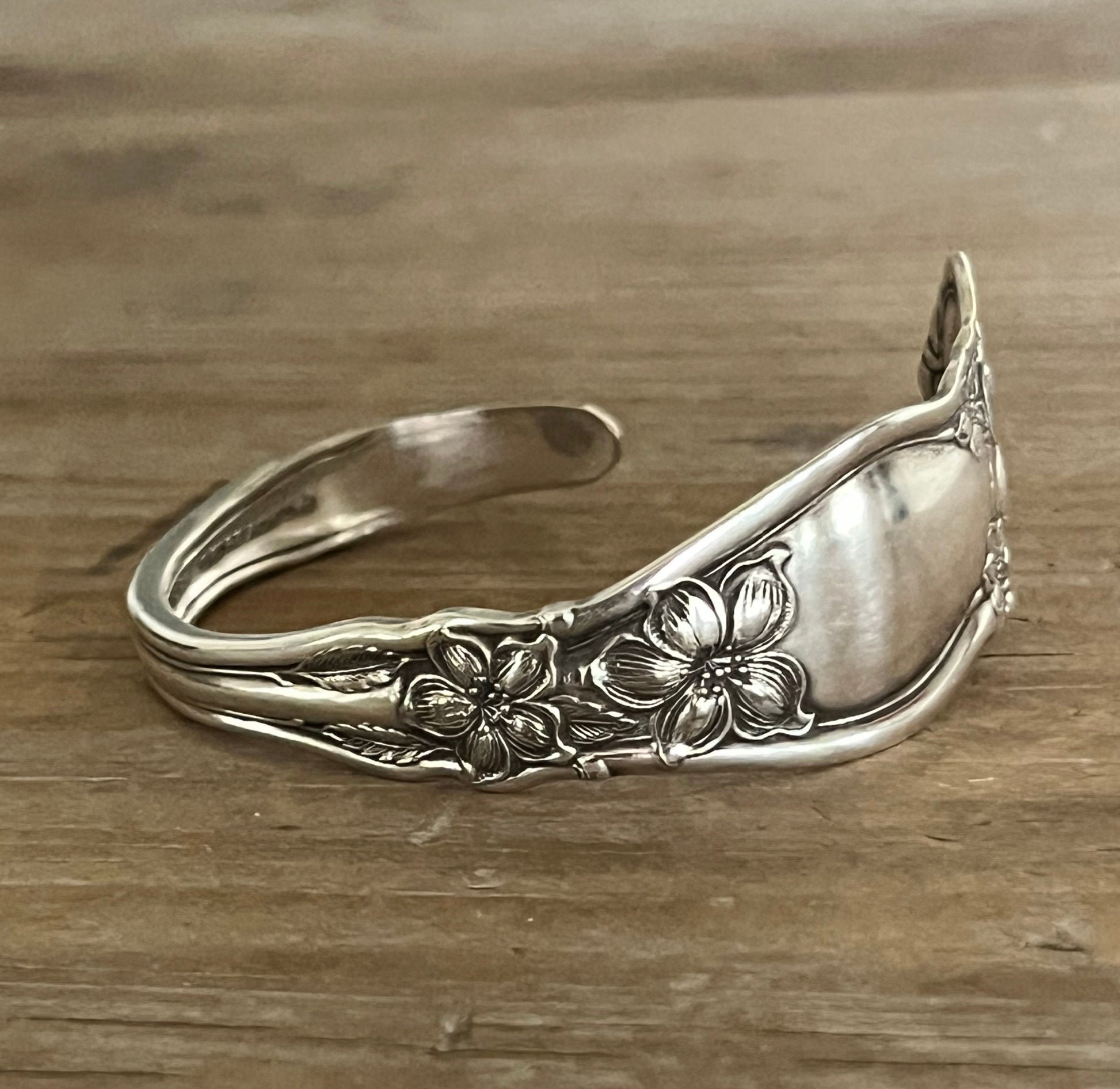 Close up view of detail on Spoon Cuff Bracelet from William Rogers & Son Orange Blossom pattern with delicate floral design