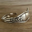 top detail photo of William Rogers & Son Orange Blossom pattern spoon cuff bracelet with ornate floral repousse - handcrafted upcycled vintage silverware cuff - Laughing Frog Studio