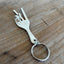 Handmade peace sign keychain from upcycled vintage fork with two-finger hand gesture