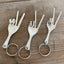 Collection of three show me your peace sign like Michael Franti handmade upcycled fork keychains