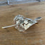Close up view of crescent-shaped cake server ponytail barrette showing curve and texture - upcycled vintage silverware - Laughing Frog Studio