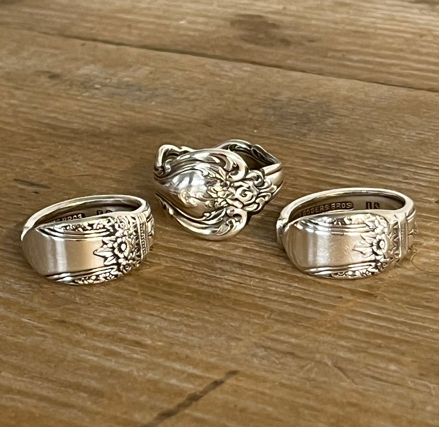 Trio of spoon rings,with First Love being the one on the far right, showcasing vintage silverware patterns