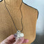 Backside of Vintage silverplate daisy spoon necklace on leather - showing repurposed spoon piece - handcrafted from upcycled vintage silverware - Laughing Frog Studio