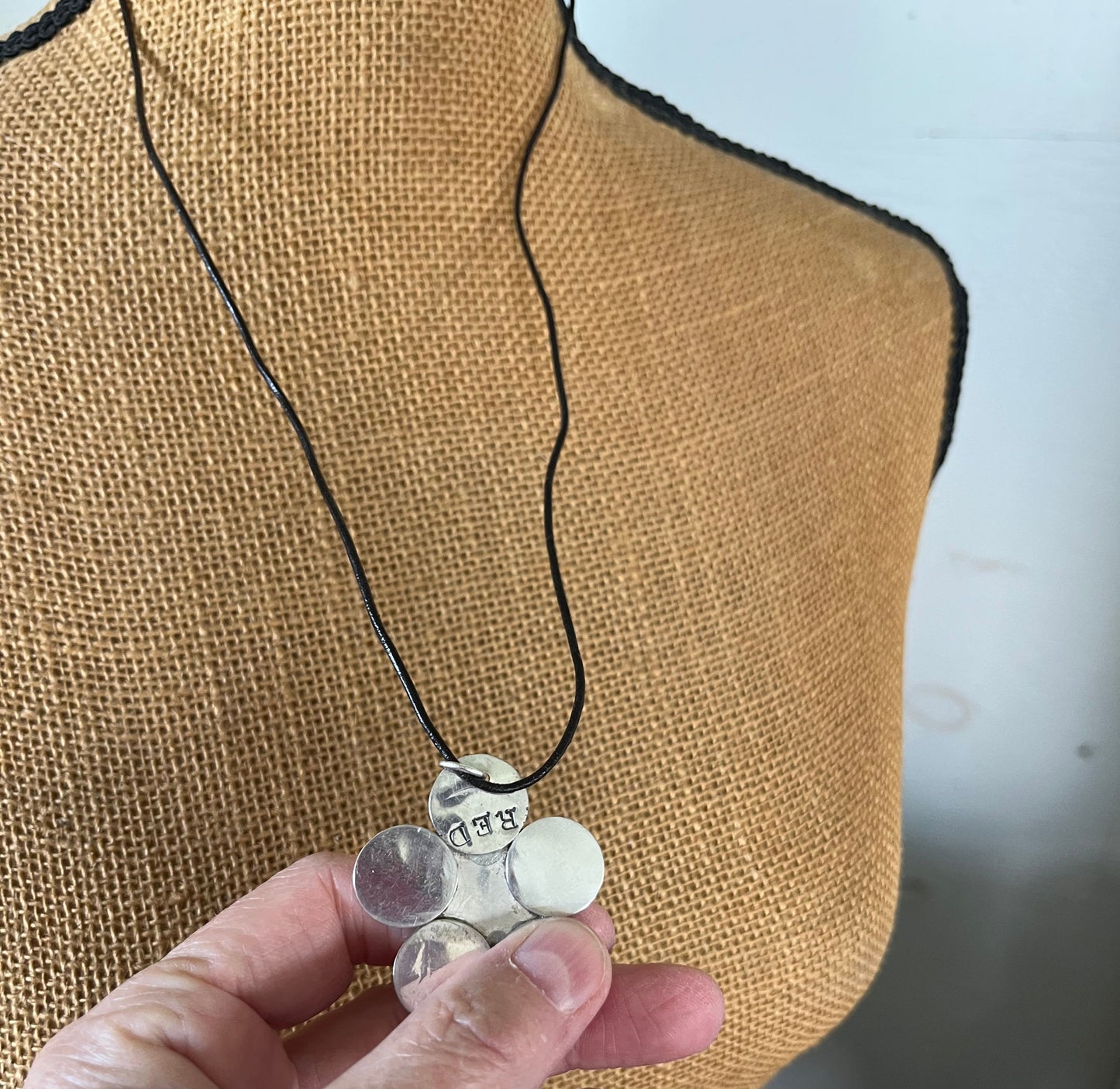 Backside of Vintage silverplate daisy spoon necklace on leather - showing repurposed spoon piece - handcrafted from upcycled vintage silverware - Laughing Frog Studio
