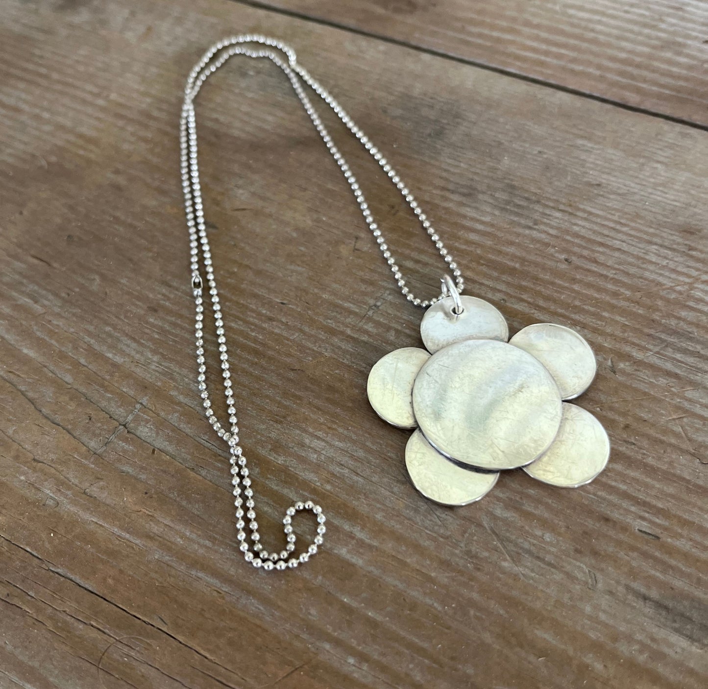 Close up view of vintage silverplate daisy spoon necklace on ball chain - Spoon Necklace - handcrafted from upcycled vintage silverware - Laughing Frog Studio
