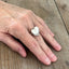 Artisan heart spoon ring featuring vintage silverplate spoon handles shown on a hand