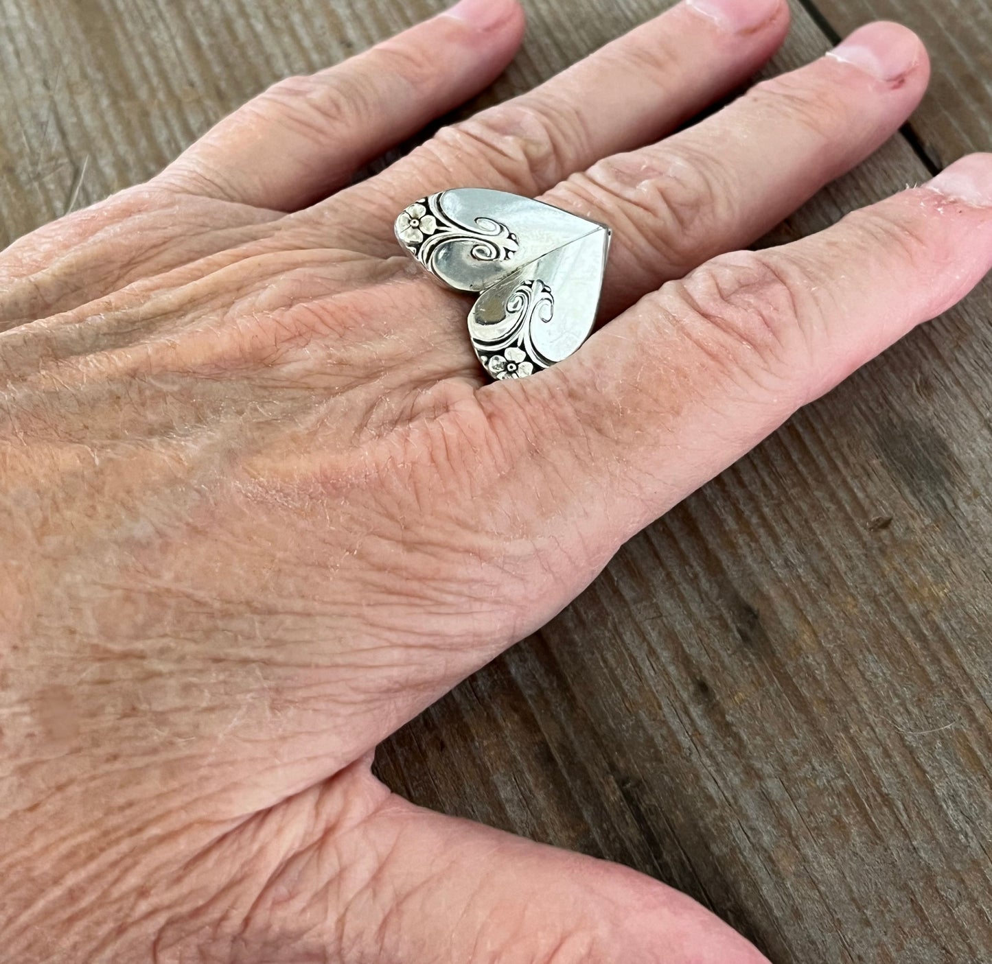 Exquisite heart ring shown on hand - romantic handcrafted upcycled silverware jewelry