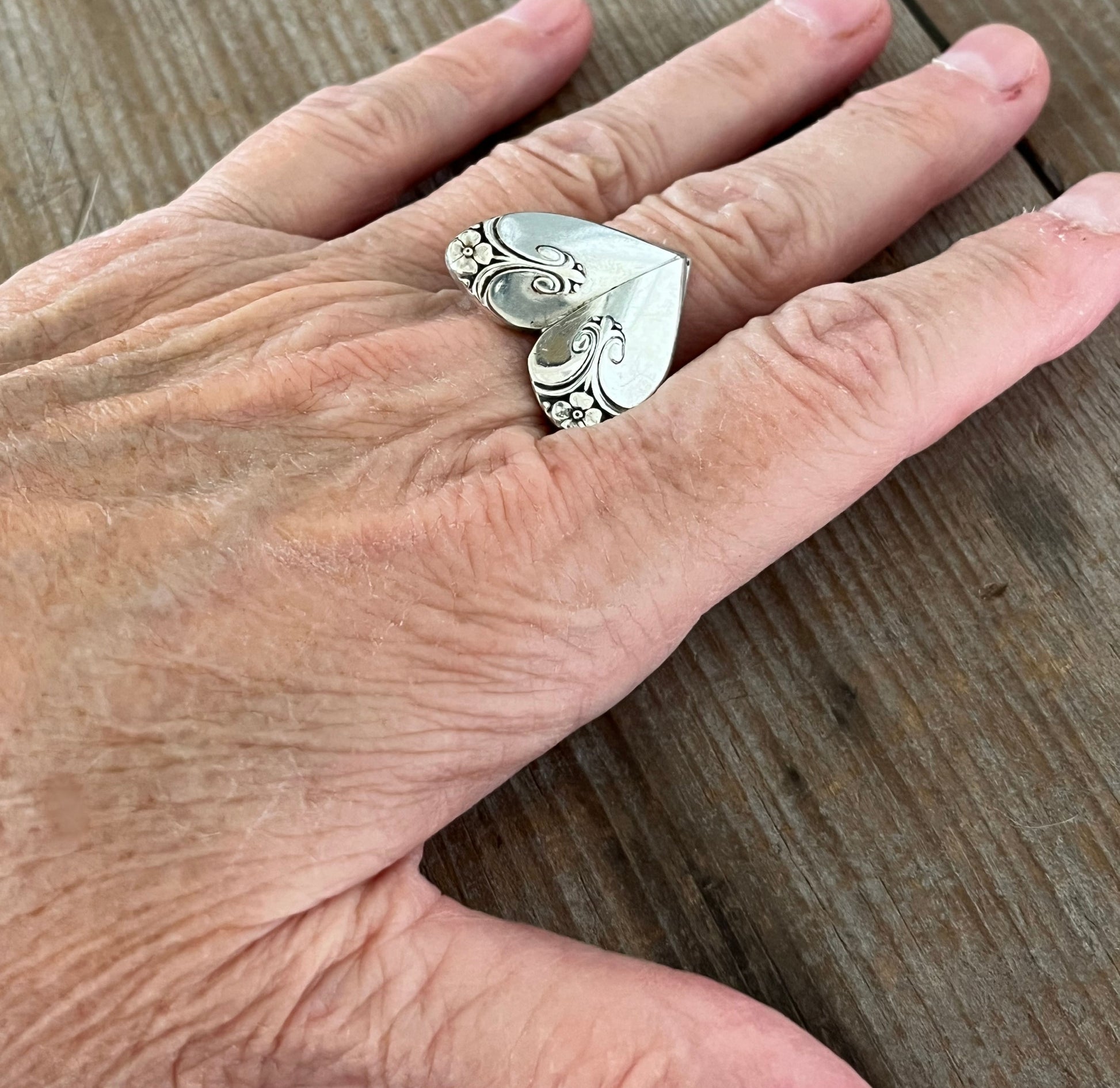 Exquisite heart ring shown on hand - romantic handcrafted upcycled silverware jewelry