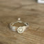 Close-up of sparkling rhinestone button centerpiece on Regent pattern spoon link bracelet - handmade artisan silverware jewelry