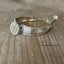 Detailed view of Regent pattern spoon links with rhinestone button - eco-friendly upcycled vintage silverware bracelet