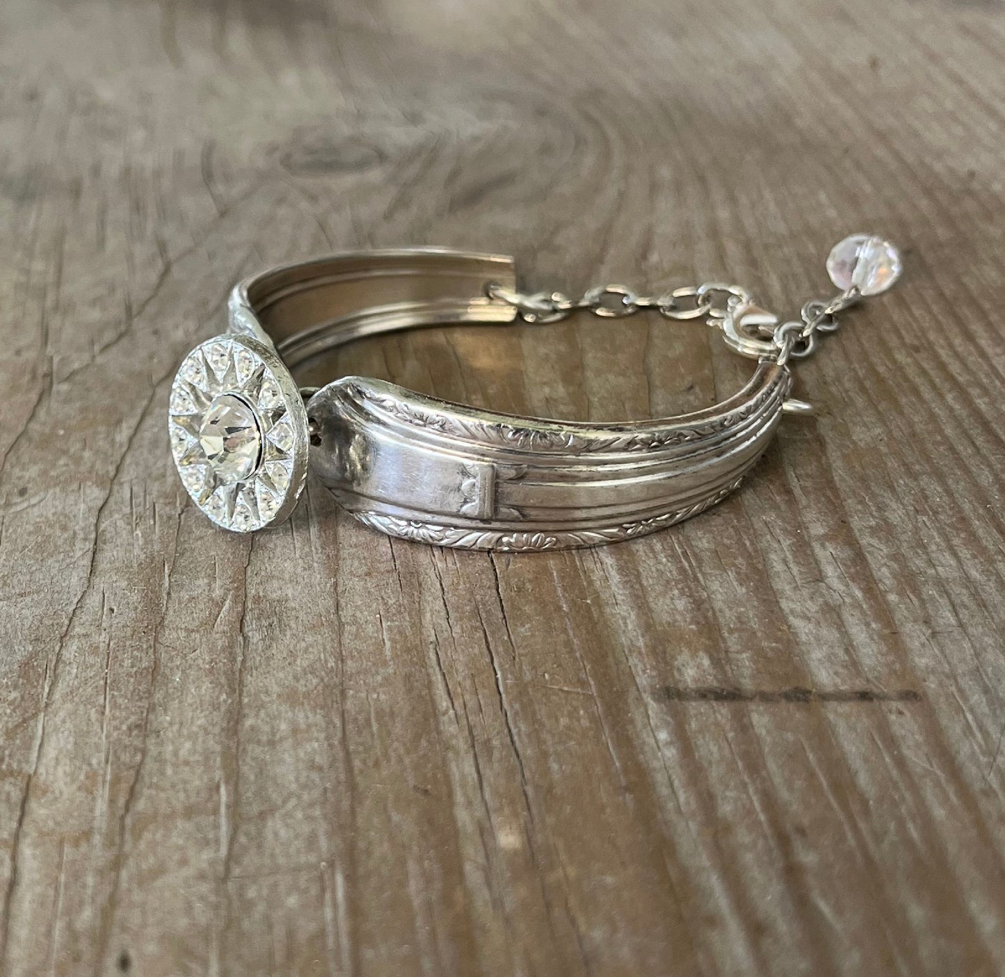 Detailed view of Regent pattern spoon links with rhinestone button - eco-friendly upcycled vintage silverware bracelet