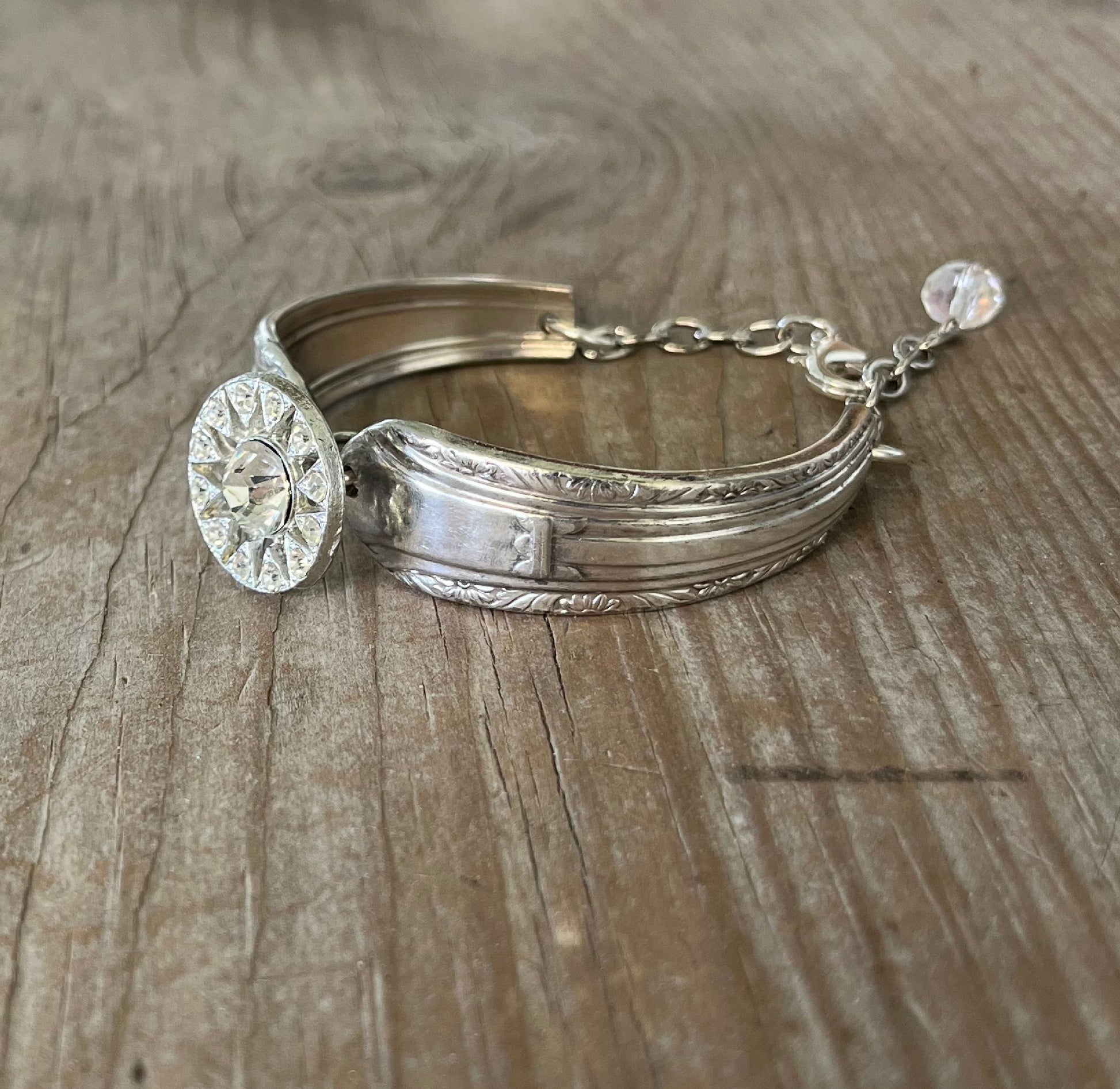 Detailed view of Regent pattern spoon links with rhinestone button - eco-friendly upcycled vintage silverware bracelet