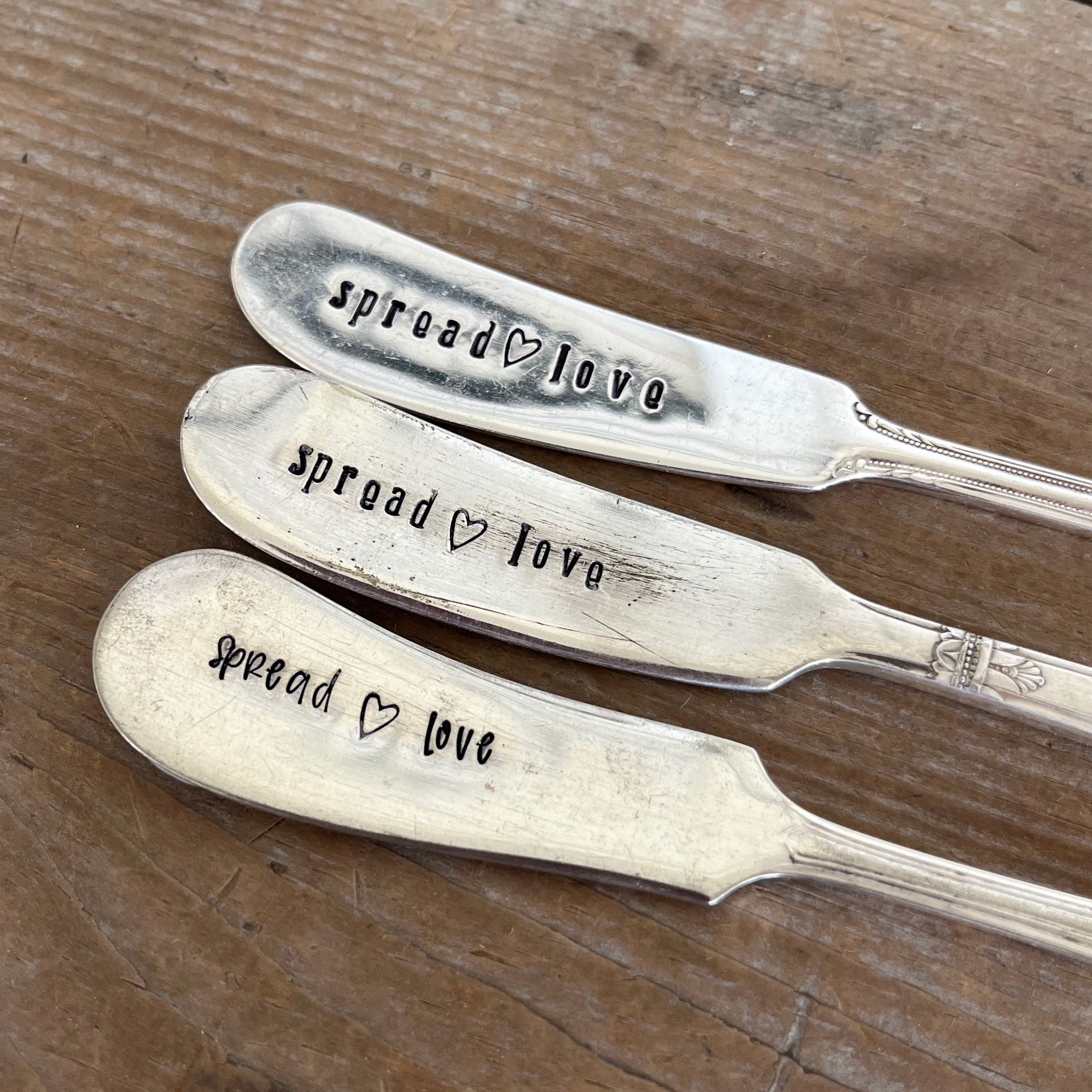 Hand-stamped vintage cheese spreader detail - Spread Love message - upcycled antique silverware