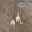 Two fork elephant necklaces side by side showing Hamsa and pearl bead variations - handcrafted from upcycled vintage silverware - Laughing Frog Studio