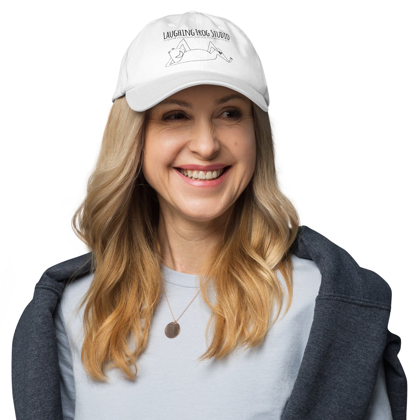 Female model wearing Laughing Frog Studio branded white canvas baseball cap - upcycled silverware jewelry accessories and more - laughingfrogstudio.com
