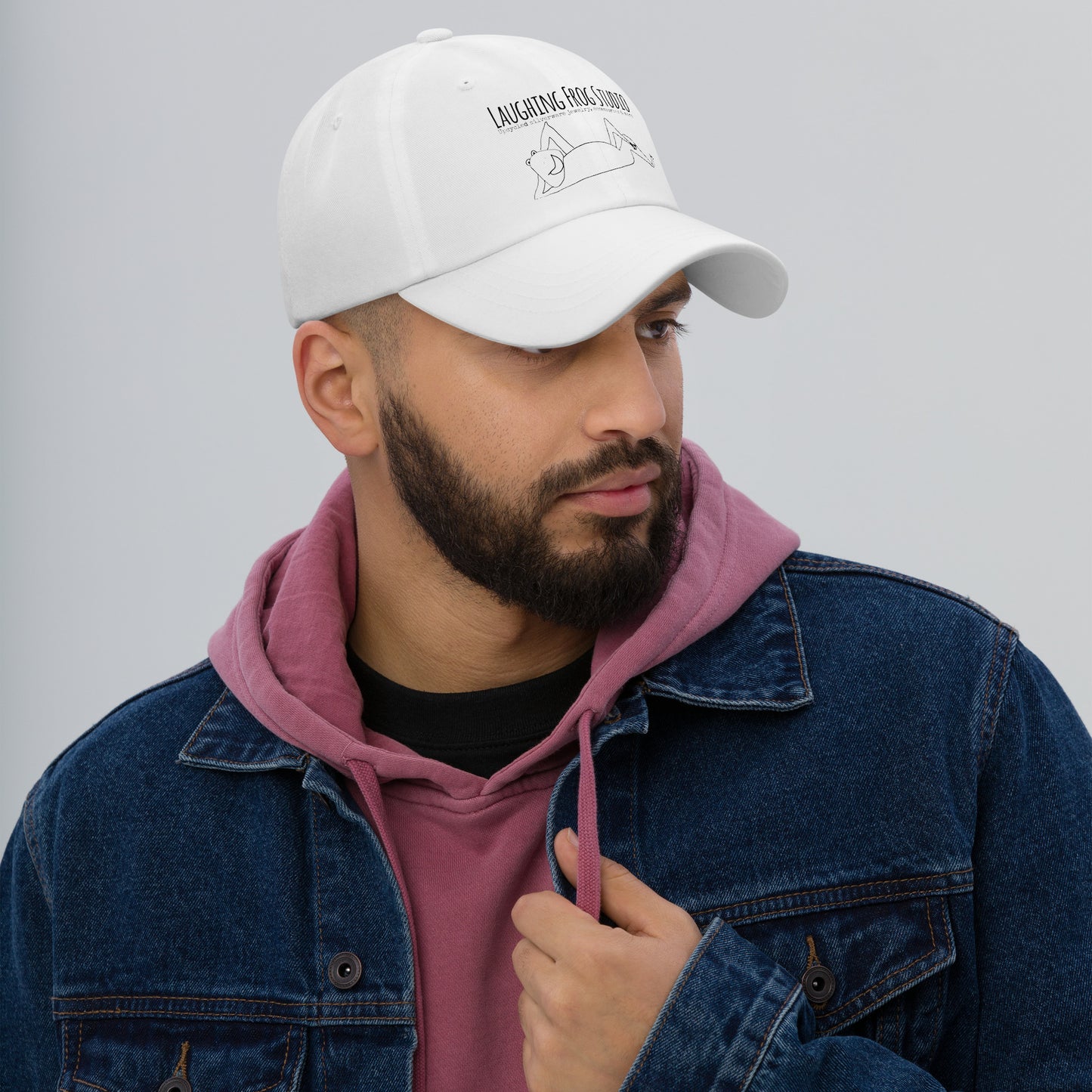 Male model wearing Laughing Frog Studio branded white canvas baseball cap - upcycled silverware jewelry accessories and more - laughingfrogstudio.com