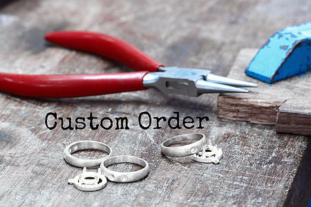 Custom Order — jeweler's pliers and handmade spoon rings on a workbench — upcycled silverware jewelry