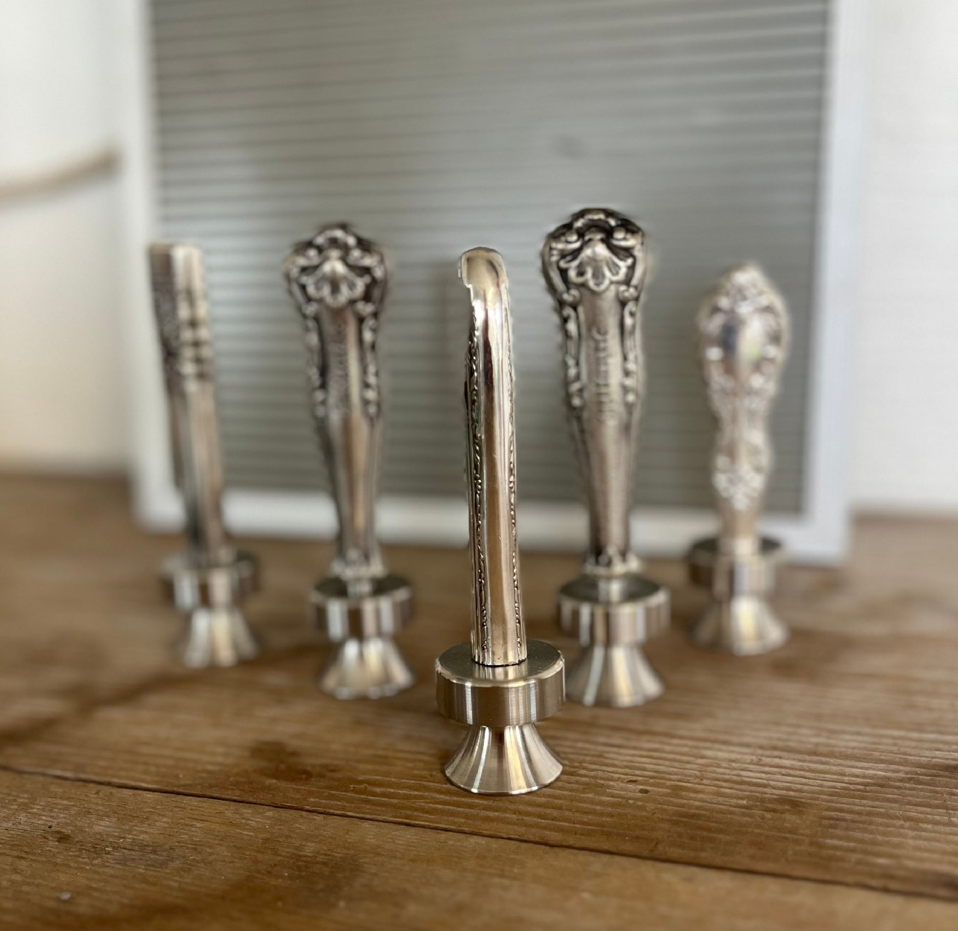 Side view of Regent knife bottle opener standing upright - upcycled vintage silverware