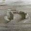 1881 Rogers Grecian pattern silverplate spoon cuff bracelet flat lay - handcrafted from upcycled vintage silverware - Laughing Frog Studio
