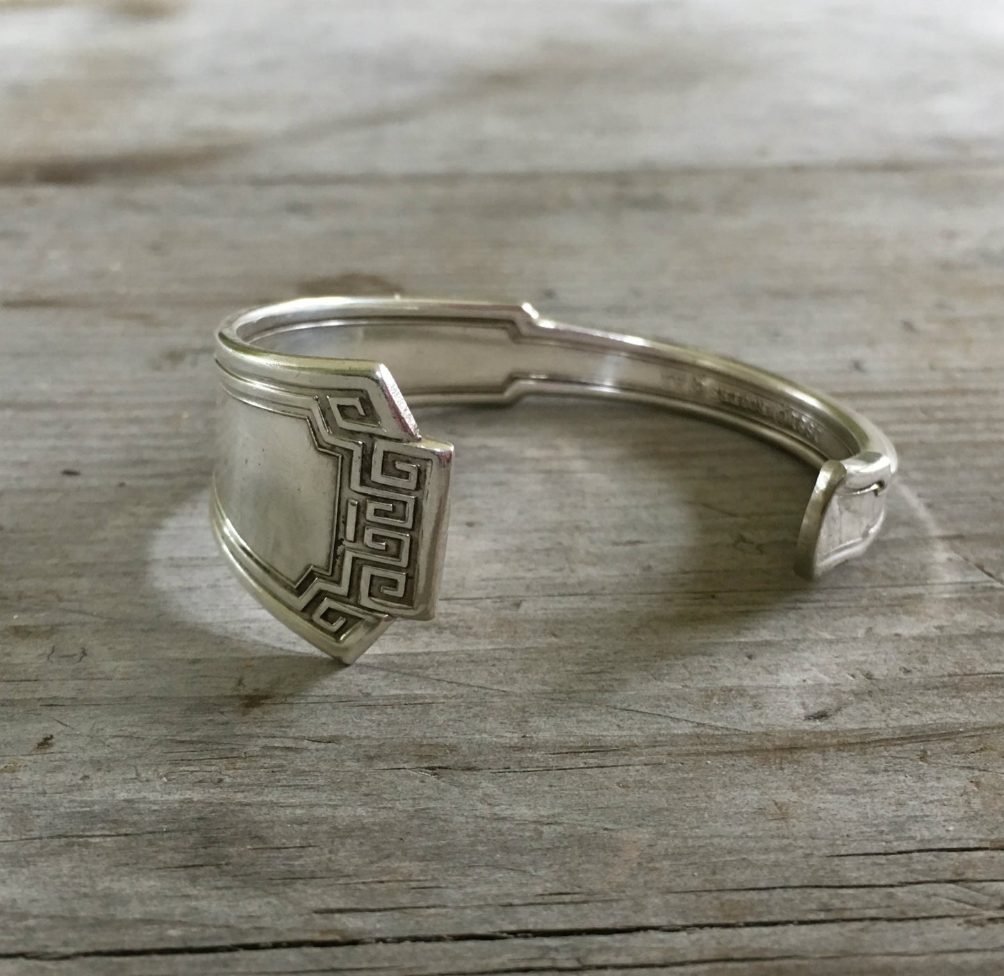 1881 Rogers Grecian pattern silverplate spoon cuff bracelet flat lay - handcrafted from upcycled vintage silverware - Laughing Frog Studio