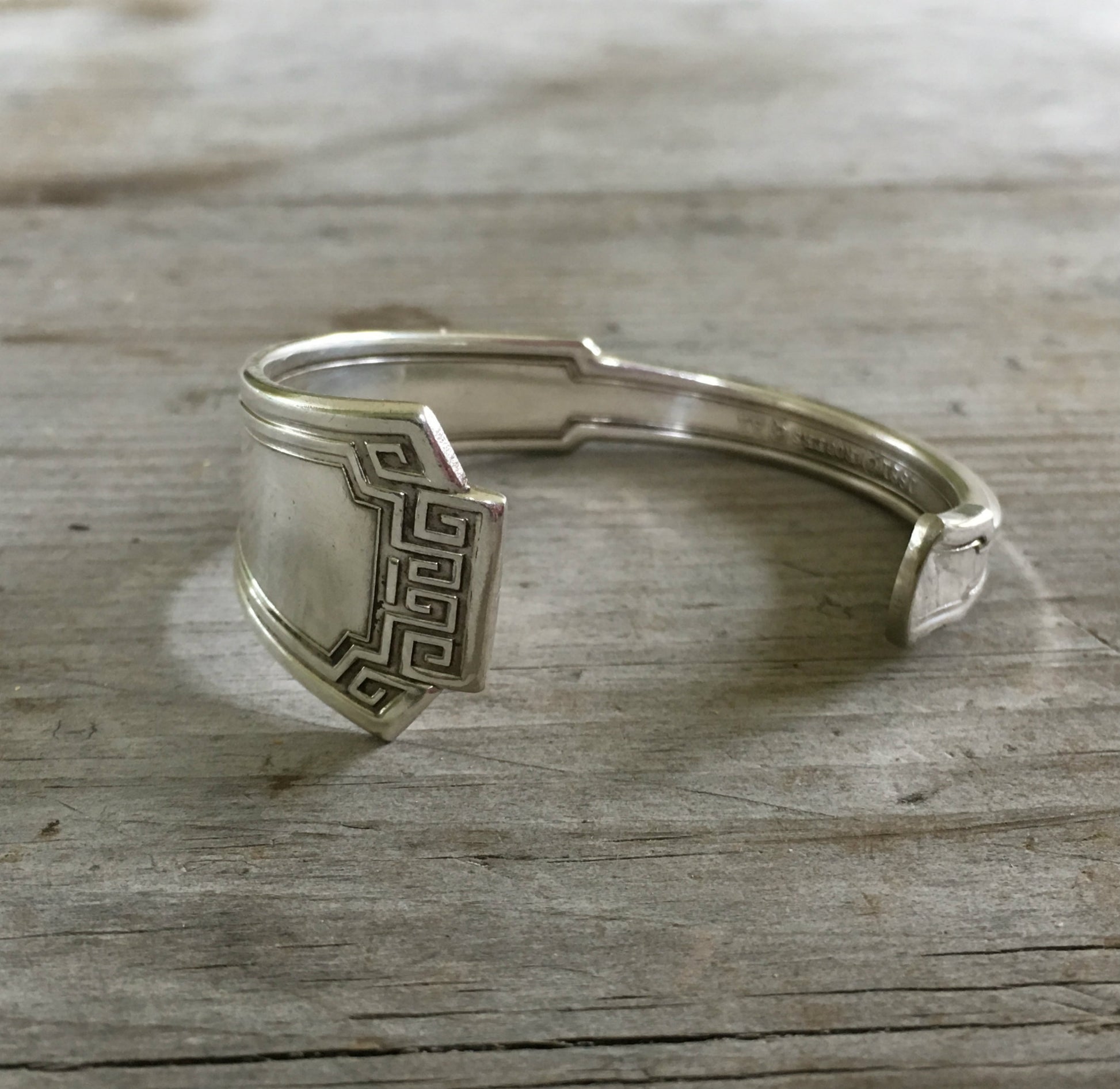 1881 Rogers Grecian pattern silverplate spoon cuff bracelet flat lay - handcrafted from upcycled vintage silverware - Laughing Frog Studio