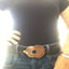Guitar spoon belt buckle modeled on leather belt showing vintage Grosvenor pattern and guitar silhouette, one-of-a-kind music-inspired accessory
