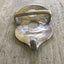 Back view of guitar spoon belt buckle showing handmade prong formed from spoon neck and catch fashioned from reclaimed silverware for snap belt